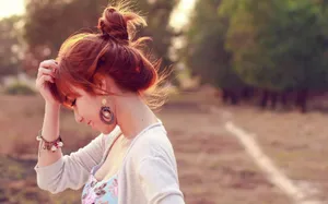 Asian Woman Profile With Messy Bun Wallpaper