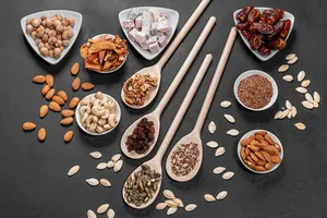 Assorted Nutsand Seedson Spoonsand Bowls Wallpaper