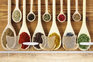 Assorted Spicesin Wooden Spoons Wallpaper