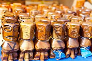 Assorted Tiki Statues Display Wallpaper