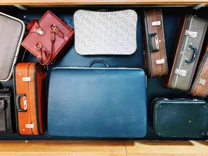 Assorted Vintage Suitcases Shelf Wallpaper