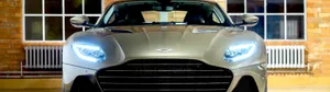 Aston Martin Dbs Superleggera On The Road, In Profile View Wallpaper