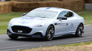 Aston Martin Rapide S - Luxury Sports Sedan In Motion Wallpaper