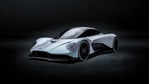 Aston Martin Valkyrie Speeding On A Racetrack Wallpaper