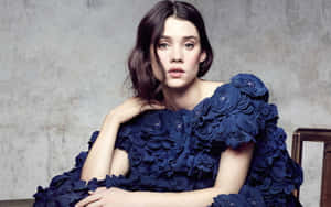 Astrid Berges Frisbey Posing Elegantly Against A Serene Backdrop Wallpaper