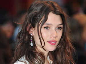 Astrid Berges-frisbey Posing Elegantly In Nature. Wallpaper