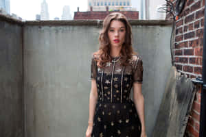 Astrid Berges Frisbey Striking A Pose Against A White Backdrop Wallpaper