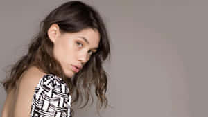 Astrid Berges-frisbey Striking A Pose On The Red Carpet Wallpaper