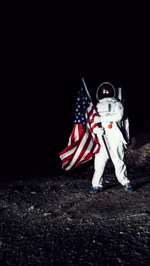 Astronaut Holding Us Flag Photography Wallpaper