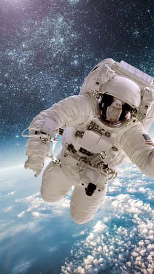 Astronaut Observing Planet Earth From Outer Space Wallpaper