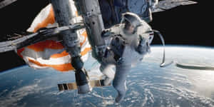 Astronaut Spacewalk Earth Backdrop Wallpaper