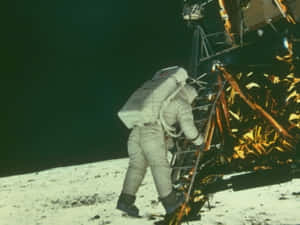 Astronaut Venturing Out Of Spacecraft During A Space Mission Wallpaper