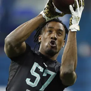 Athlete Catching Football Drill Wallpaper