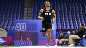 Athlete Completing40 Yard Dash Wallpaper