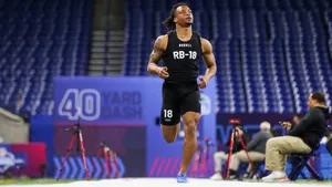 Athlete Completing40 Yard Dash Wallpaper