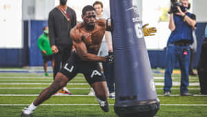 Athlete_ Performing_ Drill_at_ Combine_ Training.jpg Wallpaper