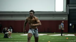 Athlete Running Drill Indoor Training Facility.jpg Wallpaper