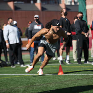 Athlete Running Drill Outdoors Wallpaper