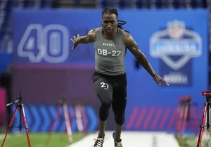 Athlete Running40 Yard Dashat Combine Wallpaper