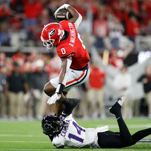 Athletic Catch Football Game Darnell Washington Wallpaper