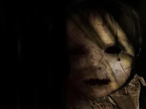 Atrocious Face Of A Creepy Doll Wallpaper