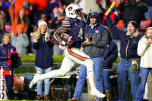 Auburn Football Player Celebration Wallpaper