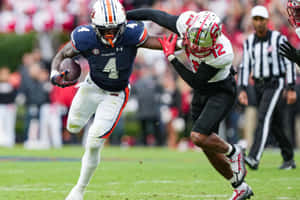 Auburn Football Player Evades Tackle Wallpaper