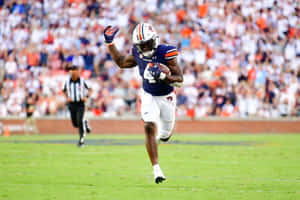 Auburn Football Player Running With Ball Wallpaper