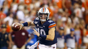 Auburn Quarterback Bo Nix In Action Wallpaper