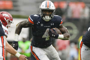 Auburn_ Running_ Back_ Action_ Shot Wallpaper