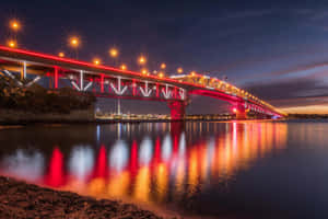 Auckland Harbour Bridge Illuminatedat Twilight Wallpaper