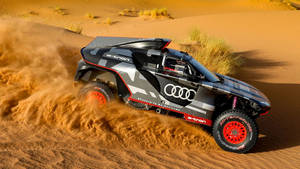 Audi Rs Speeding Through The Dakar Rally Wallpaper