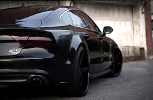 Audi S7 Driving Through City Streets Wallpaper