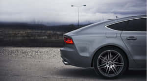 Audi S7 Sportback In Vibrant City Setting Wallpaper