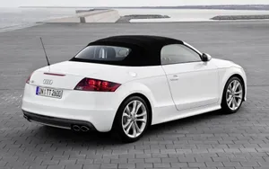 Audi Tt Coupe Parked In Front Of Modern Corporate Building Wallpaper
