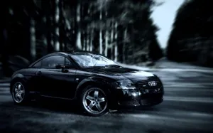 Audi Tt Sports Car On Scenic Road Wallpaper