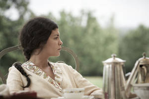 Audrey Tautou Enjoying A Coffee Break Wallpaper