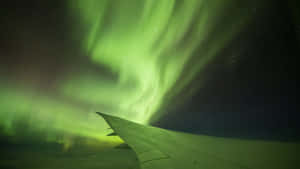 Aurora Australis From Airplane Wing Wallpaper