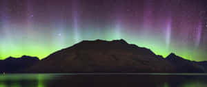 Aurora Australis Over Mountain Lake Wallpaper