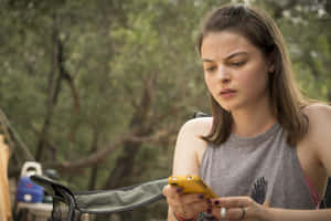 Australian Actress Tiarnie Coupland Shimmers In A Gold Dress Wallpaper