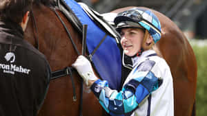 Australian Jockey Jamie Kah Posing At The Racecourse Wallpaper