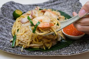 Authentic Penang Fried Hokkien Mee Capturing Flavorful Experience Wallpaper