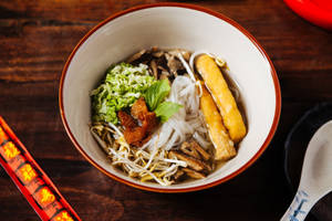 Authentic Pho Noodle Soup Served With Fresh Toppings Wallpaper