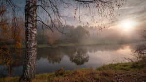 Autumnal Sunrise Reflections.jpg Wallpaper