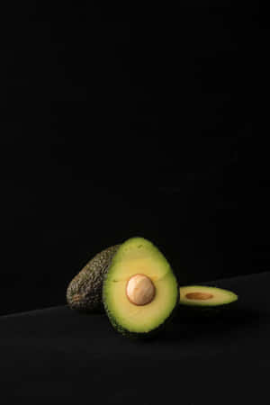 Avocado Iphone In A Dark Room Wallpaper