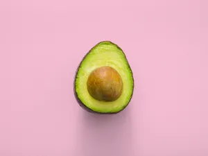 Avocado On Pink Background Wallpaper