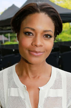 Award-winning Actress Naomie Harris Glows In Elegant Dress Wallpaper