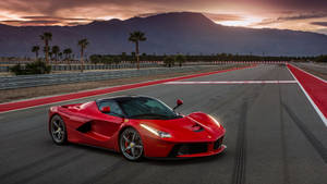 Awe-inspiring Ferrari Laferrari Basking In The Golden Morning Sun Wallpaper