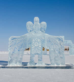 Awe-inspiring Ice Swan Sculpture Shining Under A Moonlit Night Wallpaper