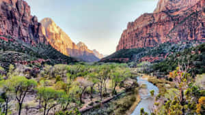 Awe-inspiring Scenic Landscape Of Sunrise Over Vast Valley Wallpaper